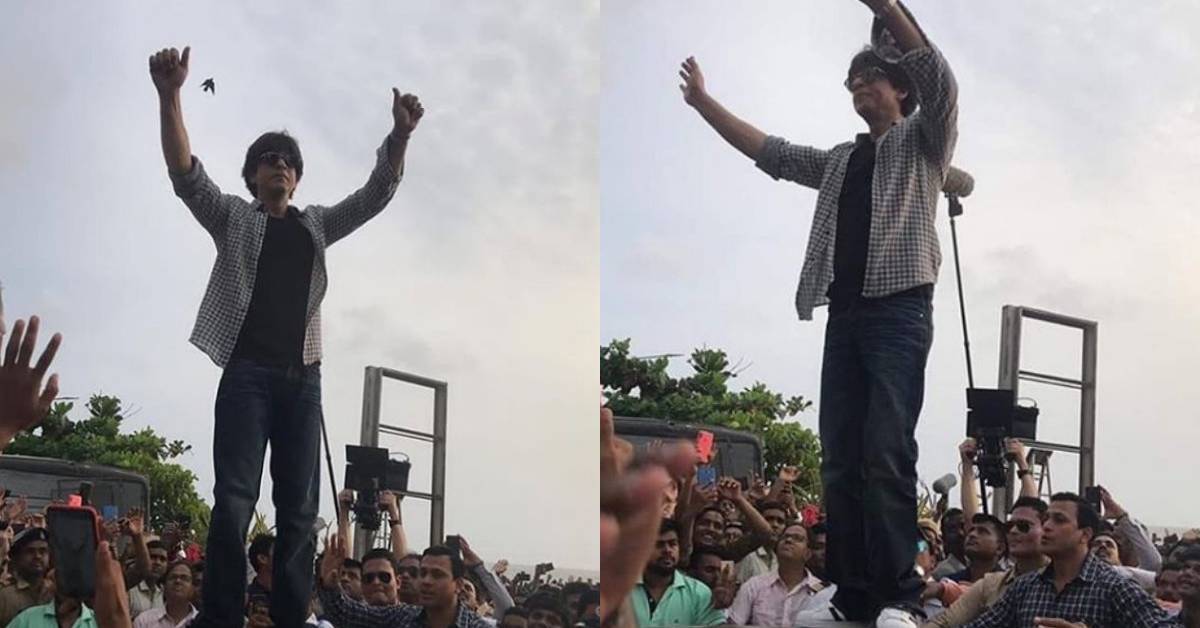 Shah Rukh Khan Creates A Frenzy Amongst Fans By Waving To Them Atop His Car!
